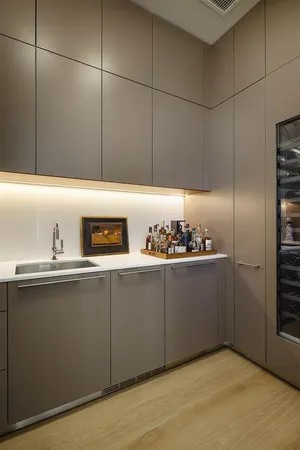 a kitchen with a sink and cabinets