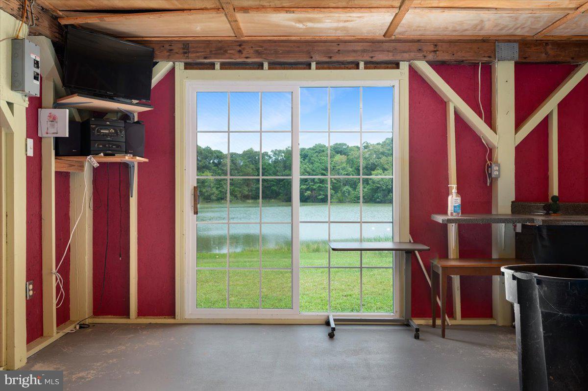 141 Raintree Lane Reedville, VA 22539 - Photo 83 of 86 Scenic lakeside retreat with vibrant walls.