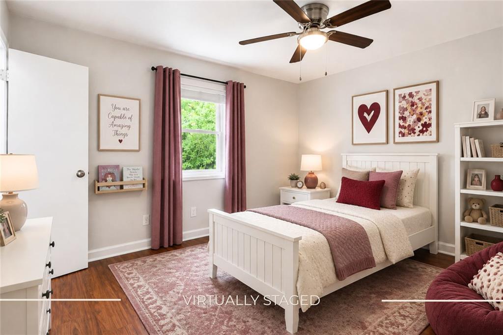 3203 East Point Street, Unit 4 Atlanta, GA 30344 - Photo 10 of 18 a bedroom with a bed and a painting on the wall