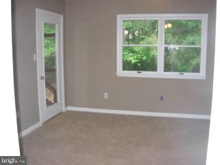 104 Sandyhook Road Ocean Pines, MD 21811 - Photo 5 of 6 a view of an empty room with a window