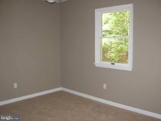 104 Sandyhook Road Ocean Pines, MD 21811 - Photo 6 of 6 an empty room with a window