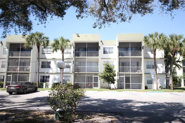 a view of a building with a street