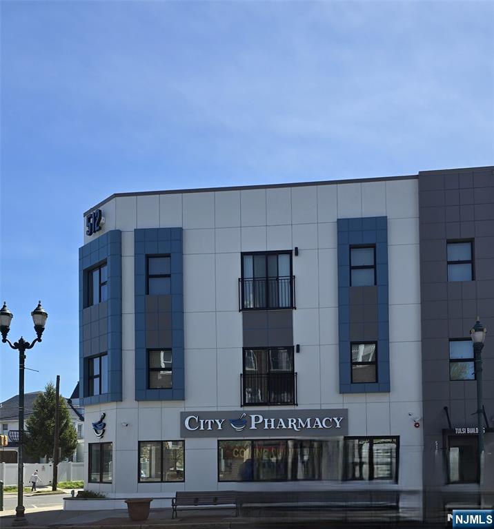 512 Kearny Avenue, Unit 302 Kearny, NJ 07032 - Photo 2 of 13 a building with street view