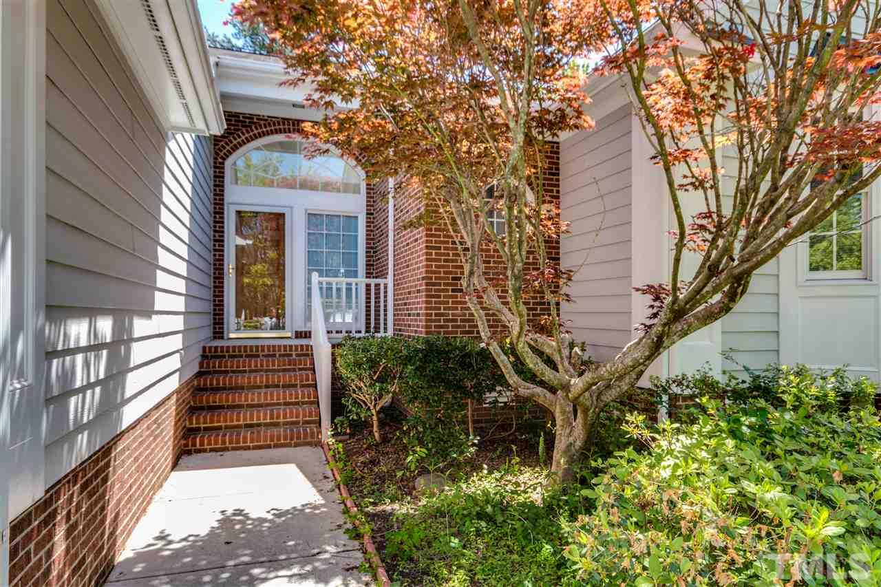2337 Kendricks Court Raleigh, NC 27613 - Photo 2 of 25 a front view of a house with a garden