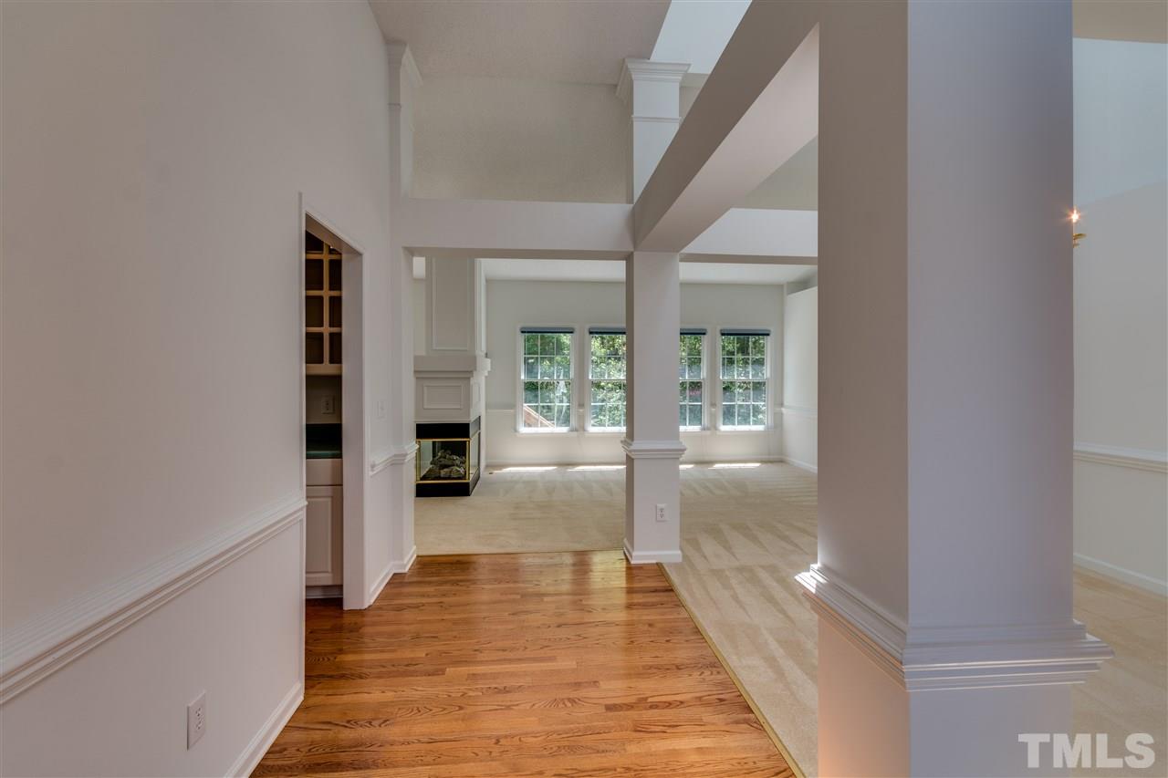 2337 Kendricks Court Raleigh, NC 27613 - Photo 3 of 25 a view of a hallway view with wooden floor and staircase