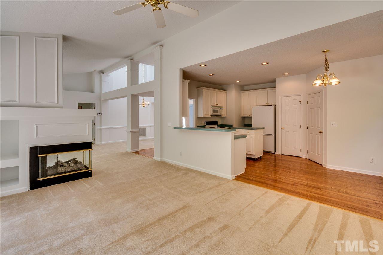 2337 Kendricks Court Raleigh, NC 27613 - Photo 8 of 25 a view of a kitchen with a sink and a fireplace