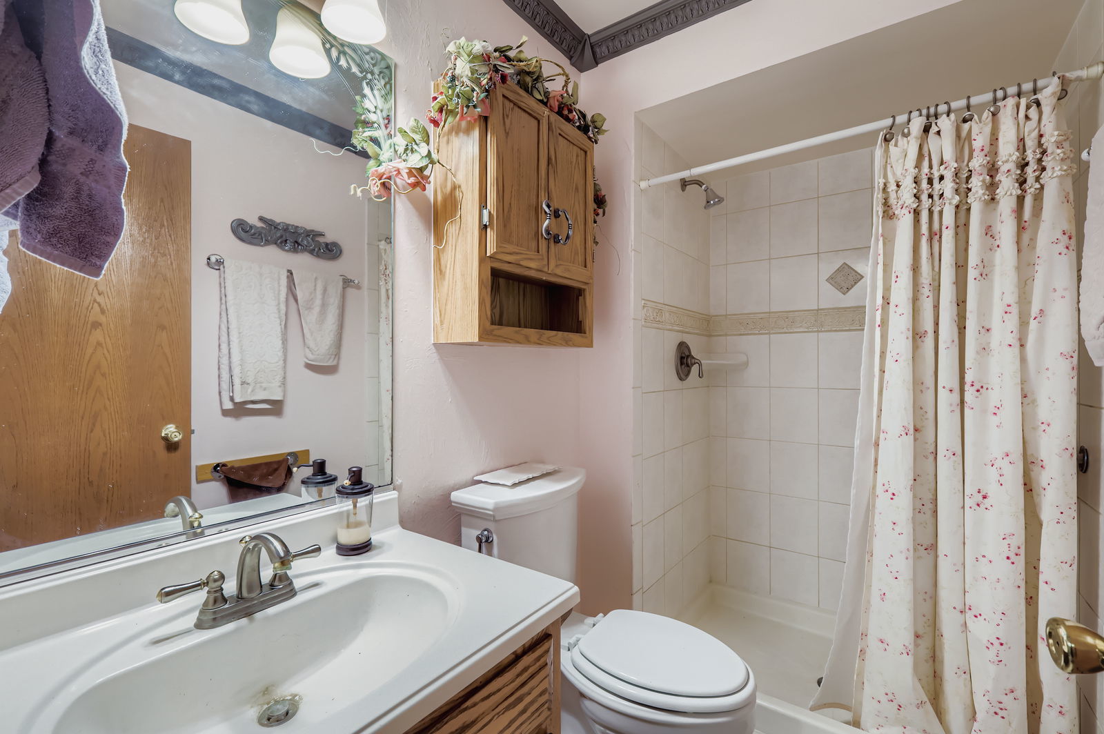 10785 Ashford Avenue Frankfort, IL 60423 - Photo 18 of 42 a bathroom with a sink toilet and shower