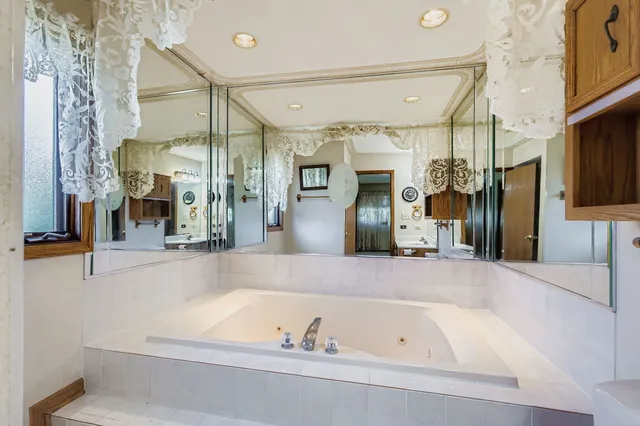 a bathroom with a bathtub and a shower