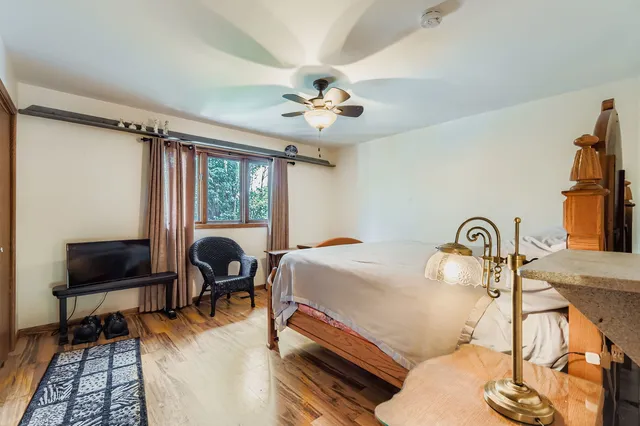 a bedroom with furniture and a window