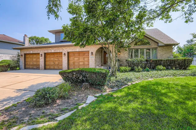 front view of a house with a yard