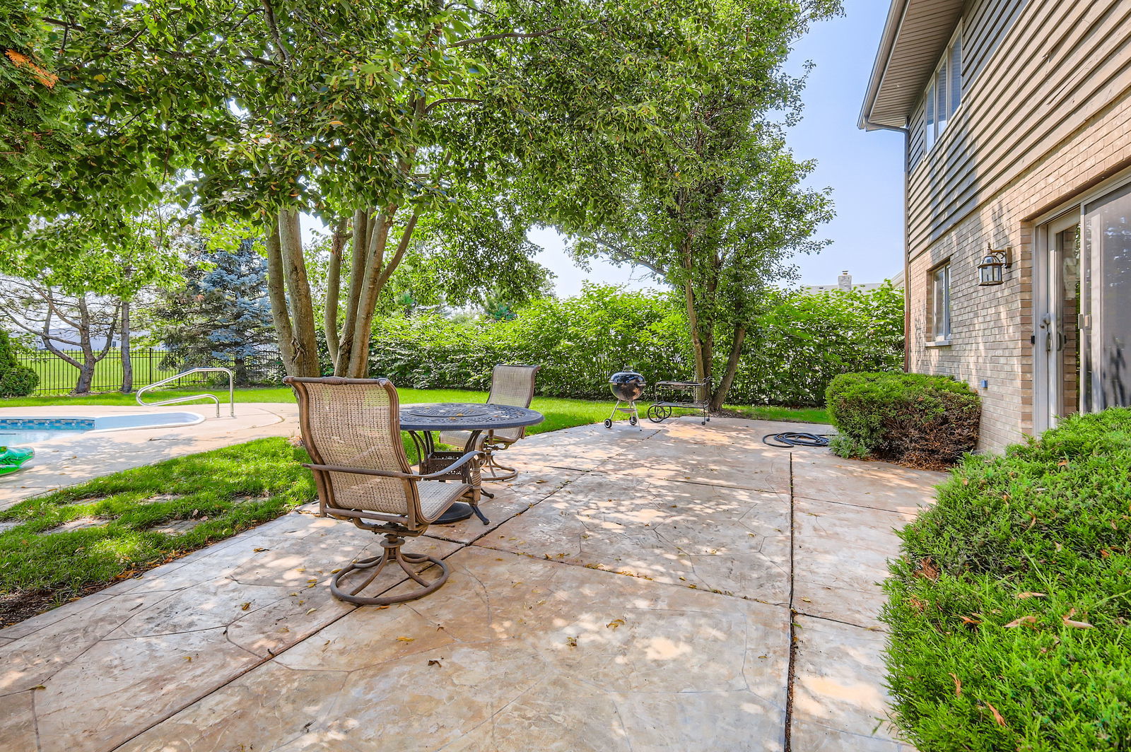 10785 Ashford Avenue Frankfort, IL 60423 - Photo 36 of 42 a view of a bench in a backyard of a house