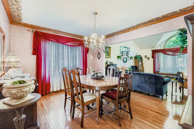 a dining room with furniture and window