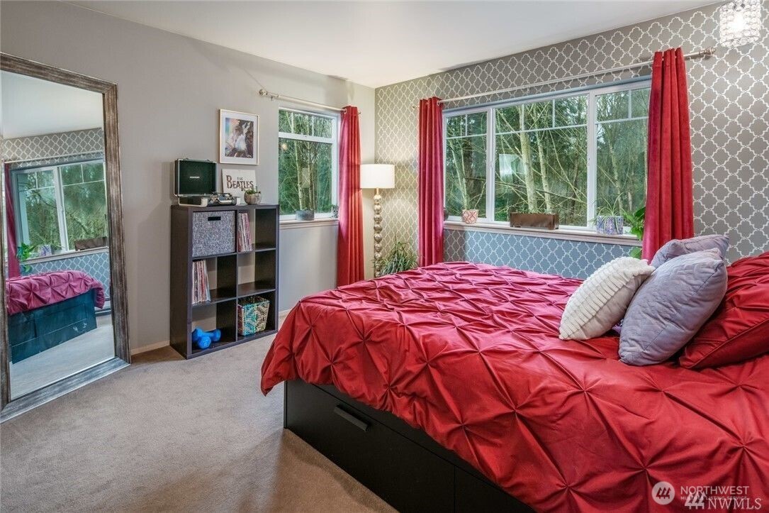 15300 112th Avenue Northeast, Unit B308 Bothell, WA 98011 - Photo 11 of 15 a bedroom with a bed and a large window