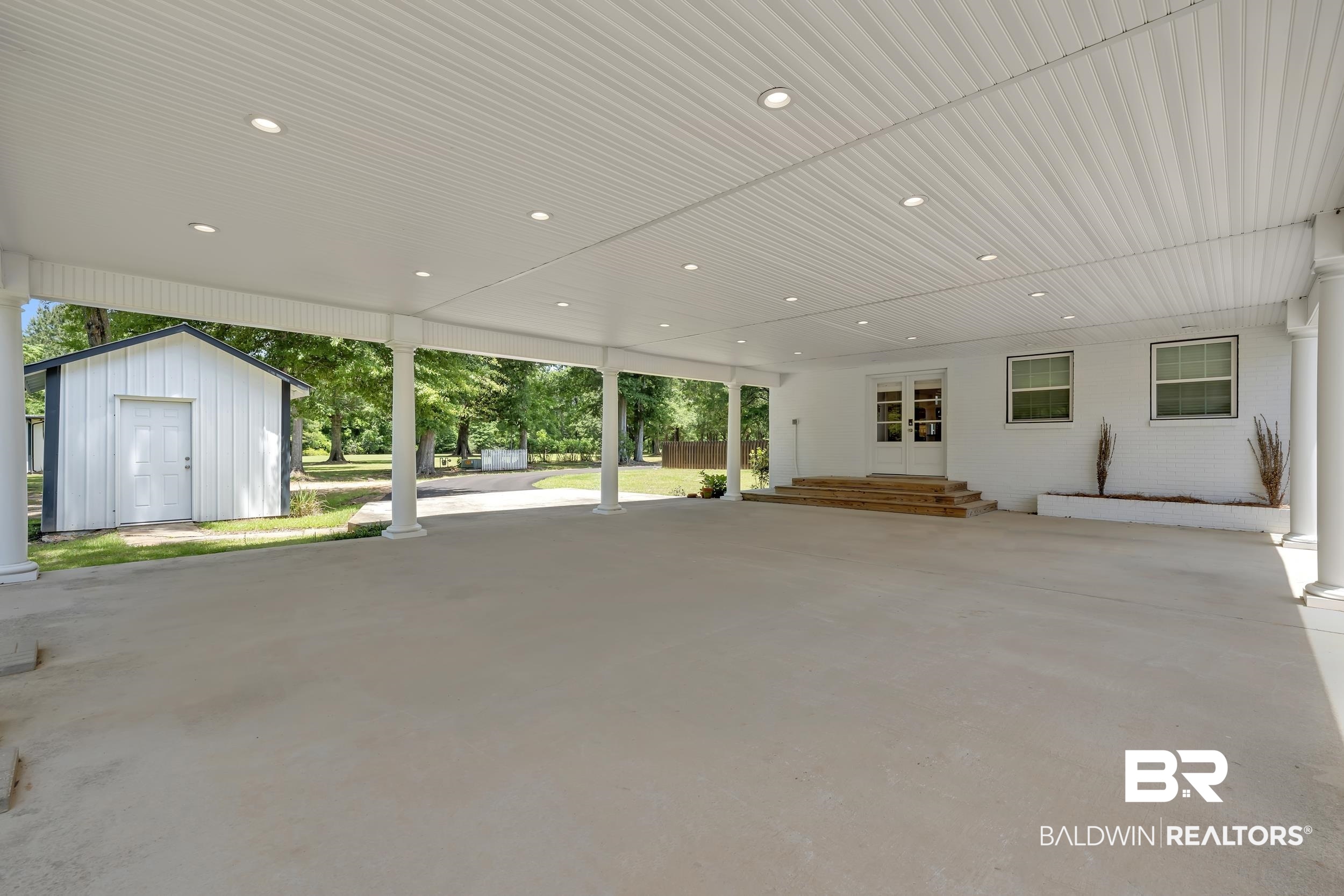 43199 Pine Grove Road Bay Minette, AL 36507 - Photo 6 of 71 Expansive covered patio featuring a concrete surface, recessed lighting, and a beadboard ceiling