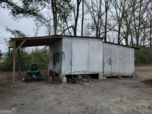 a view of car parked in back yard