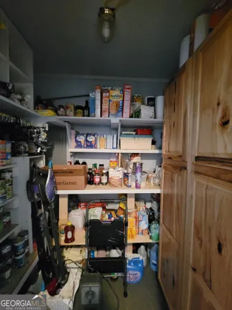 a room with storage and a book shelf