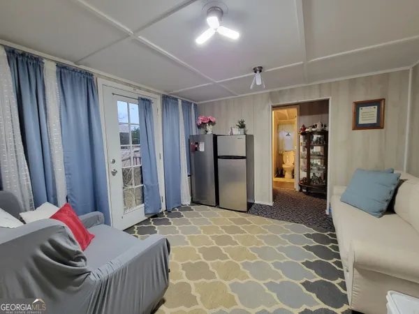 a living room with furniture and a area