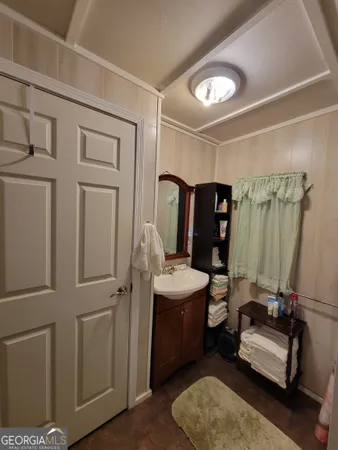 a bedroom with furniture and a wooden floor