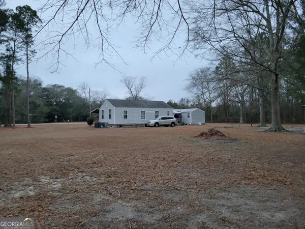 a view of a field with of trees