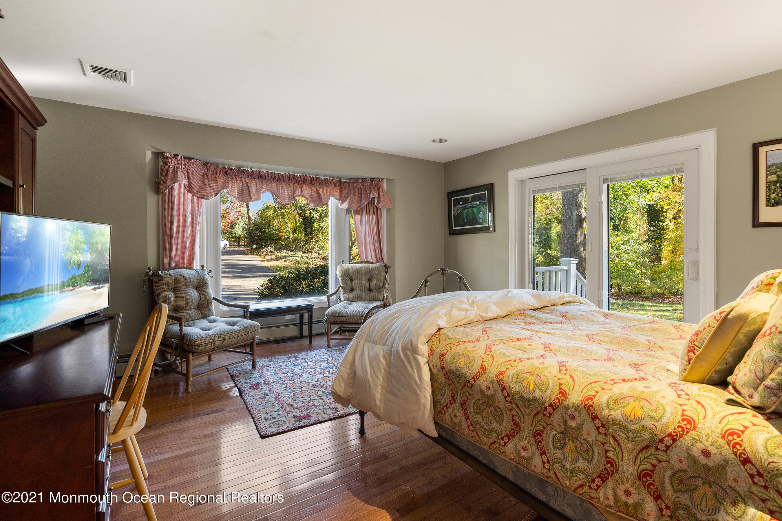 181 Mc Clees Road Red Bank, NJ 07701 - Photo 14 of 26 a bed sitting in a bedroom next to a window