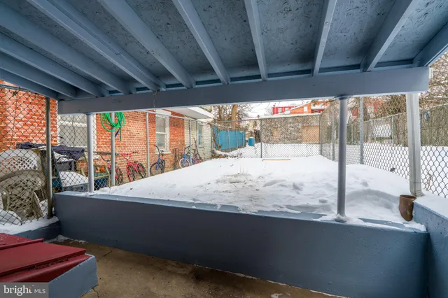 a bed sitting in a bedroom next to a large window