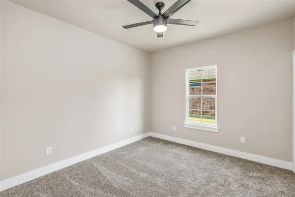 a bathroom with a granite countertop sink double and mirror
