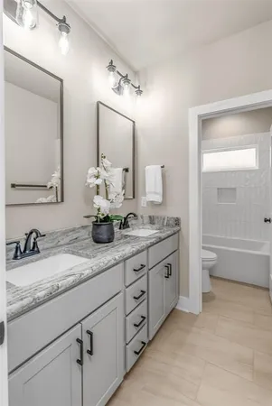 a bathroom with a bathtub toilet and shower