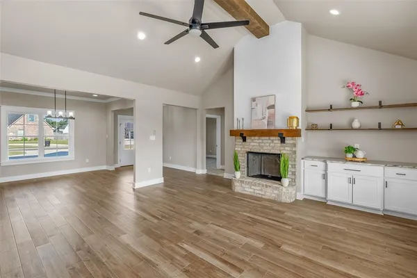 a view of a kitchen with furniture and a fireplace