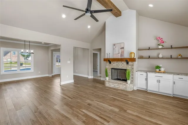 a view of a kitchen with furniture and a fireplace
