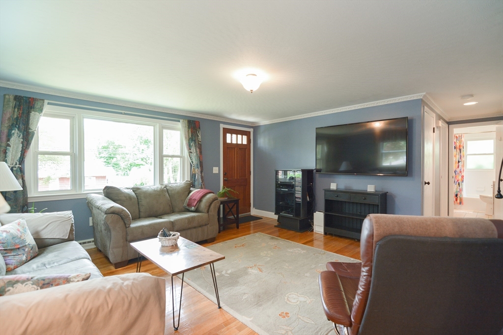 48 Smiths Lane Kingston, MA 02364 - Photo 14 of 38 a living room with furniture and a flat screen tv