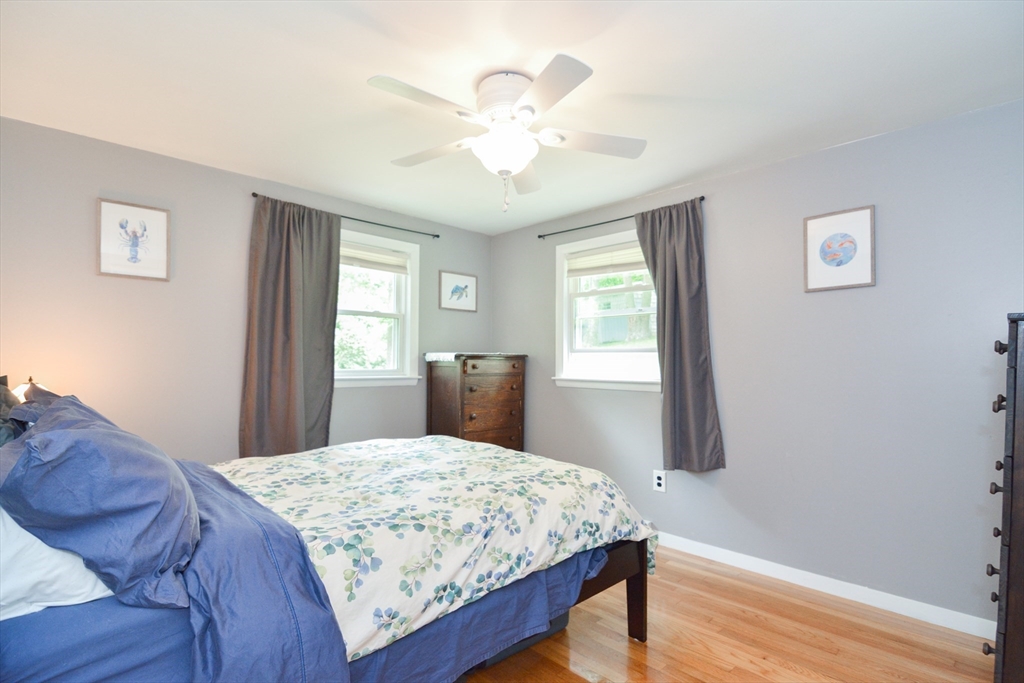 48 Smiths Lane Kingston, MA 02364 - Photo 16 of 38 a living room with a bed furniture and a window
