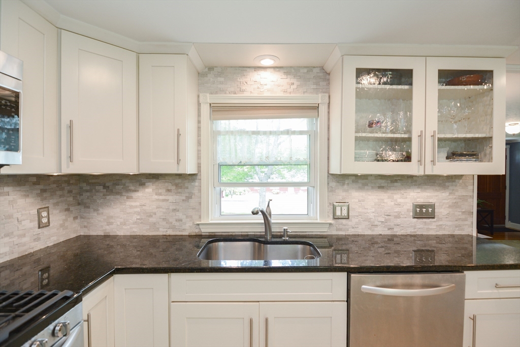 48 Smiths Lane Kingston, MA 02364 - Photo 8 of 38 a kitchen with granite countertop a sink and a window