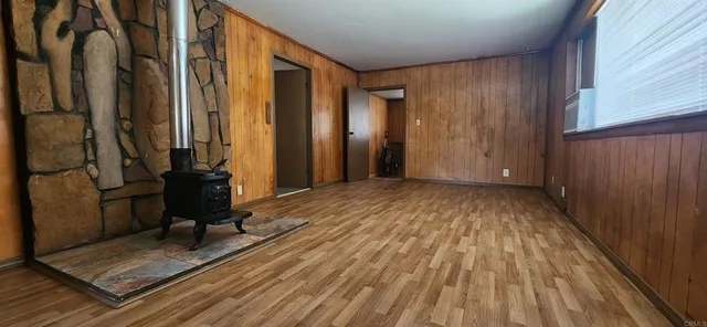 a view of a room with wooden floor and chair
