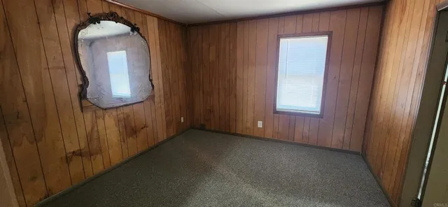 a view of a mirror and a mirror in a room