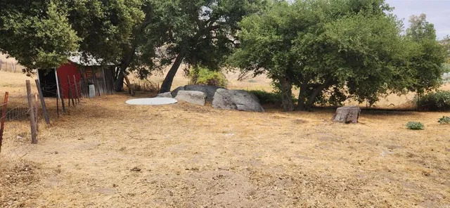 a backyard of a house with lots of green space