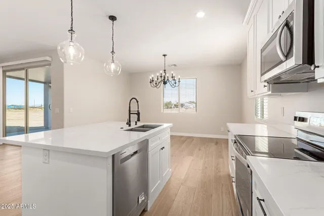 a living room with furniture a flat screen tv and a large window