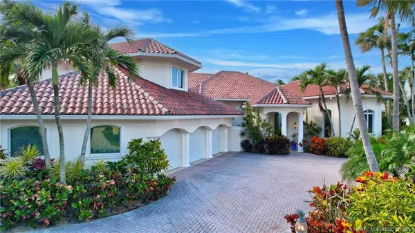 front view of a house with a garden