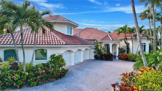 front view of a house with a garden