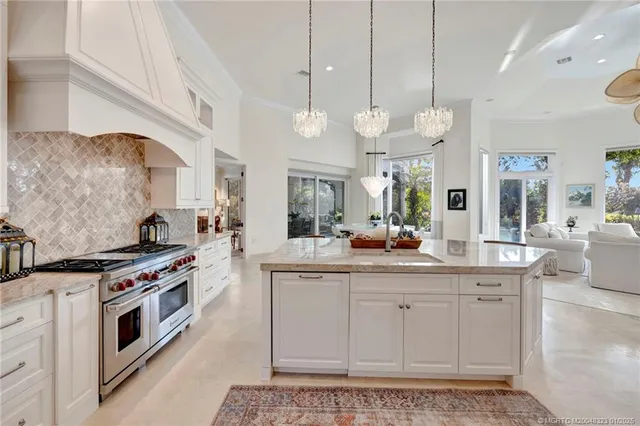 a bedroom with a bed a ceiling fan and a dresser