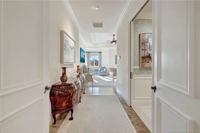 a spacious bedroom with a bed a mirror and lamp