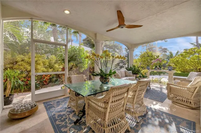 a view of swimming pool with outdoor seating and a garden