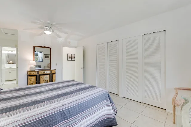 a bedroom with a bed and a view of bathroom