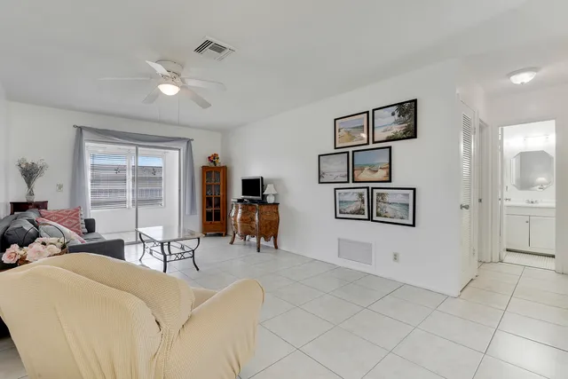 a view of a livingroom with furniture and a window