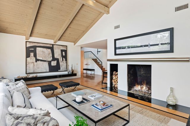a living room with furniture and next to a window