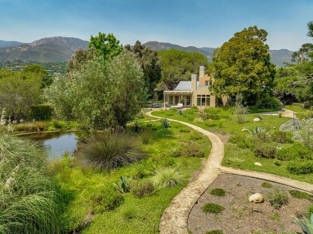 a view of a lake with a garden