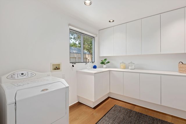 front view of a house with swimming pool and porch with furniture