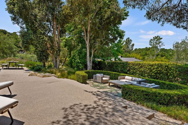 a garden view with a seating space