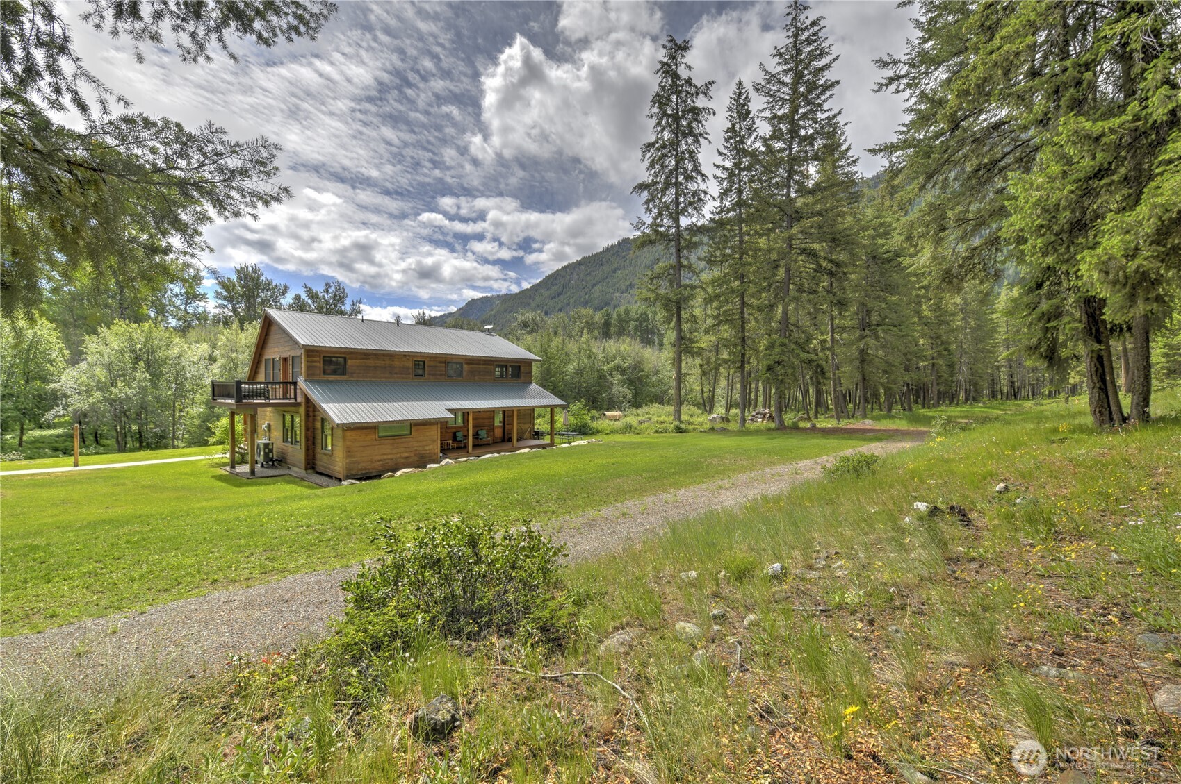 19 A And B Two Rivers Road Mazama, WA 98833 - Photo 23 of 40 a view of a house with a big yard