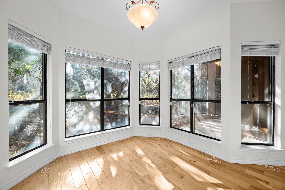 4711 Spicewood Springs Road, Unit 2107 Austin, TX 78759 - Photo 15 of 26 a view of an empty room with a window and a bed