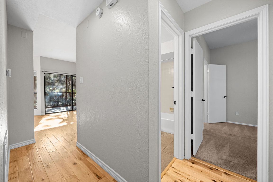 4711 Spicewood Springs Road, Unit 2107 Austin, TX 78759 - Photo 16 of 26 a view of bedroom with wooden floor